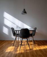 Modern interior design with a minimalist dining table and chairs photo