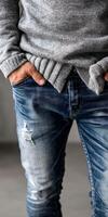 Casual outfit featuring distressed jeans in indoor setting photo