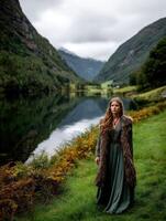 Viking woman stands by a serene lake surrounded by mountains photo