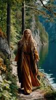 Portrait of a Viking woman walking by a serene lake in nature photo