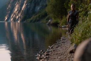 Viking woman walking along a serene lake at twilight near mountains photo