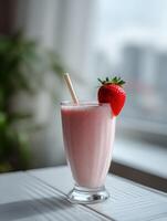 Refreshing strawberry protein shake garnished with fresh fruit photo