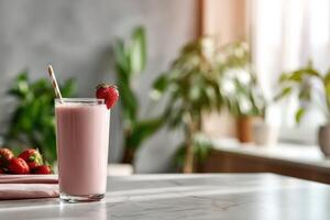 Delicious protein shake with strawberries in a bright kitchen setting photo
