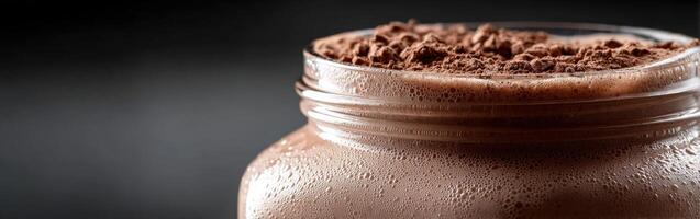 Chocolate protein shake ready for consumption in a modern kitchen photo