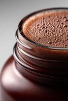 Protein shake in a glass jar ready for consumption after workout photo
