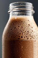 Protein shake in a glass jar with frothy texture highlighted photo