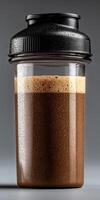 Delicious protein shake in a shaker bottle with condensation photo