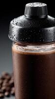 Refreshing protein shake with chocolate flavor in a shaker cup photo