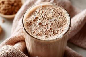 Protein shake packed with nutrients served in a clear glass photo