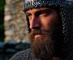 Focused knight in chainmail armor at a reenactment photo