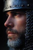 Close-up of a medieval knight in chainmail and helmet photo