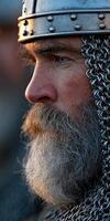 Warrior with chainmail and fierce expression during sunset photo
