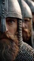 Warriors in chainmail prepare for battle in a medieval setting photo