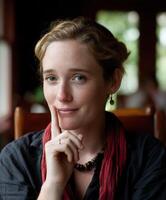 Woman with thoughtful expression in a cozy indoor setting photo