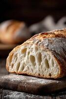 Freshly baked bread with a golden crust and airy interior photo