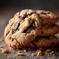 Deliciously baked chocolate chunk cookies stacked on a wooden surface photo
