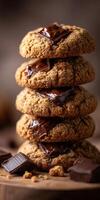 Stack of freshly baked cookies with melted chocolate inside photo