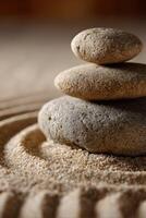 Balanced stones on sand create a calming zen garden atmosphere photo