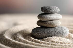 Calm zen garden with stacked stones and raked sand patterns in evening light photo