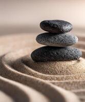 Balanced stones create a tranquil scene in a sandy zen garden photo