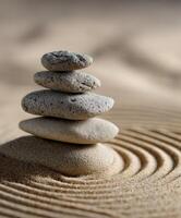 Calm and soothing stone stack on serene sand ripples at sunrise photo