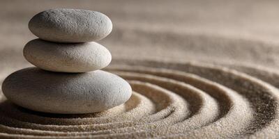 A stack of stones on top of a sand dune photo