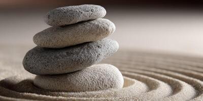 A stack of stones in a sand pit photo