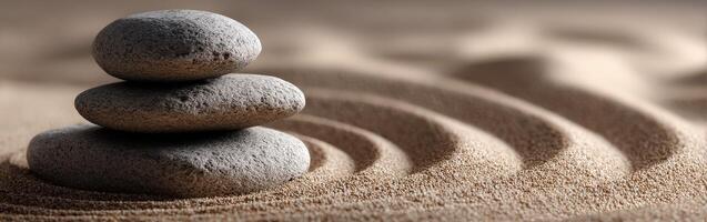 A stack of rocks sitting on top of sand photo