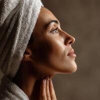 Woman in spa attire enjoying tranquility and self-care at home photo