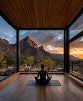 Serene yoga practice at sunset in a mountain retreat photo
