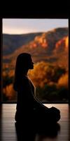 Meditation at sunset with a backdrop of stunning mountains and nature photo