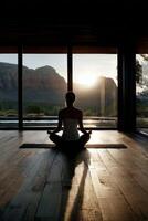Meditation session with mountain view at sunset in a serene atmosphere photo
