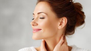Woman enjoying a moment of relaxation with a serene expression indoors photo