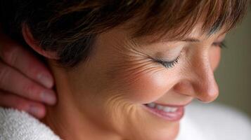 Woman enjoying a soothing massage in a calming indoor setting photo