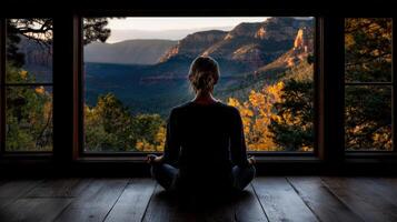 Meditation in a serene mountain retreat at sunset with stunning views photo