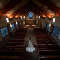 Bride stands alone in a serene church setting before the wedding ceremony photo