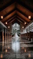 Bride in elegant gown stands in serene wedding venue with wooden beams photo