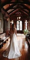 A bride walking through the hallways of a large mansion photo