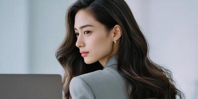 Professional woman working in a modern office environment during the day photo