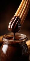 Delicious churro dipped in rich chocolate sauce in a cozy setting photo