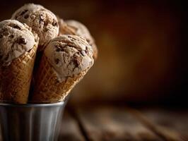 Delicious chocolate chip ice cream cones ready to enjoy in a rustic setting photo