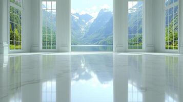 A room with windows looking out on a lake and mountains photo