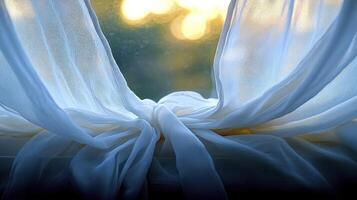A window with a white curtain and a sun in the background photo