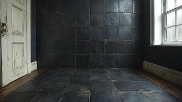 A dark room with a black tile floor and wooden floor photo