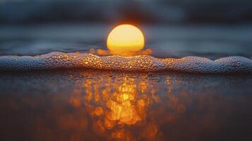 A candle is lit on the beach with foam photo