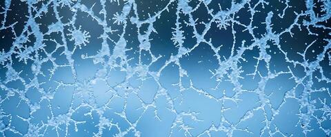close up of a frosted window with a blue background photo