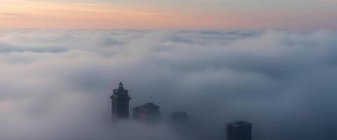 view of a city in the middle of a sea of clouds photo