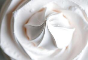 close up of a white cake with icing photo