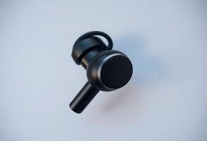 close up of a black object on a white surface photo