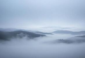 foggy landscape with mountains in the distance photo